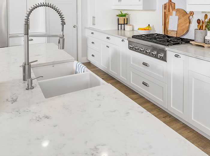 quartz countertop with white cabinets in kitchen